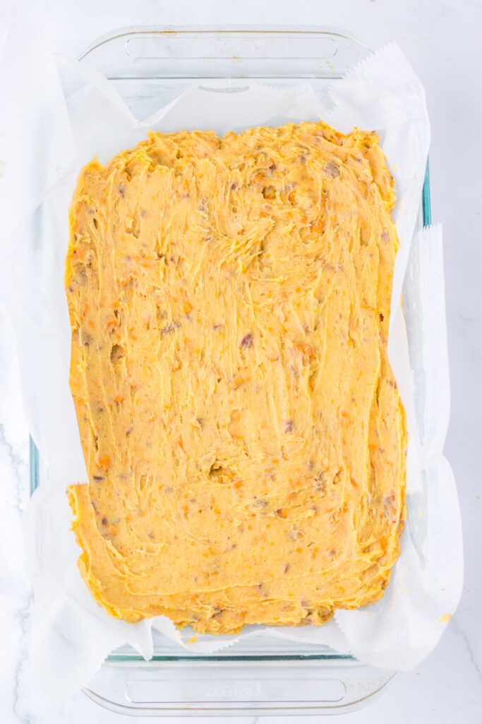 Butterfinger micture spread evenly in a baking dish