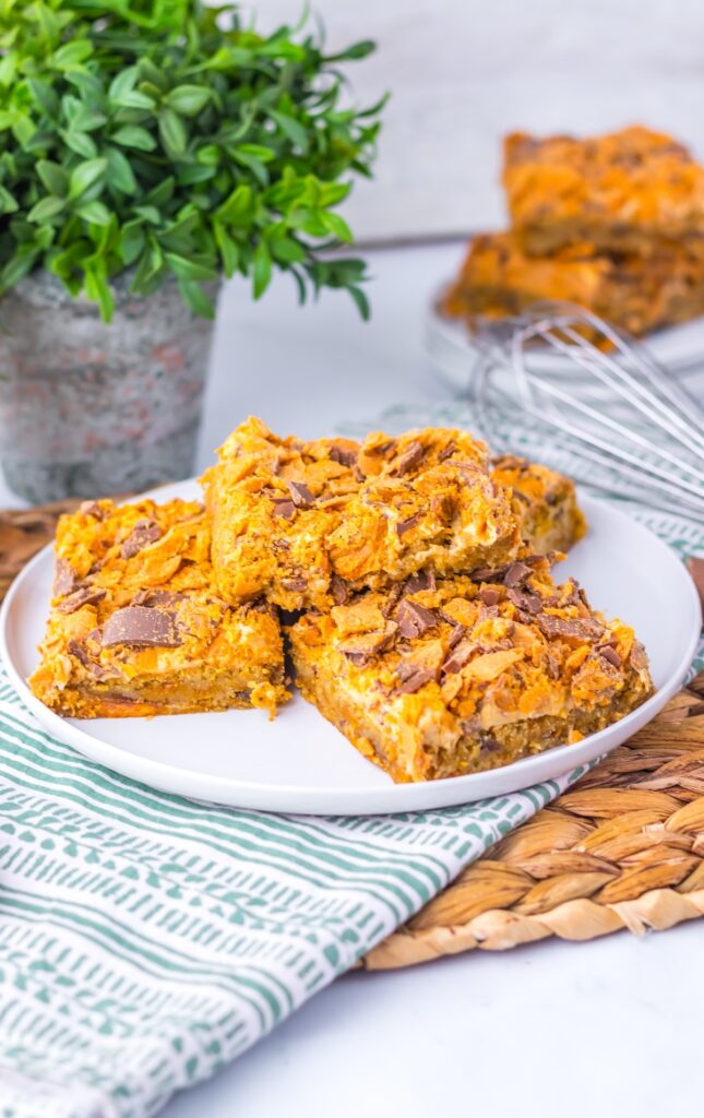 Three slices of butterfinger cookie bar in a plate