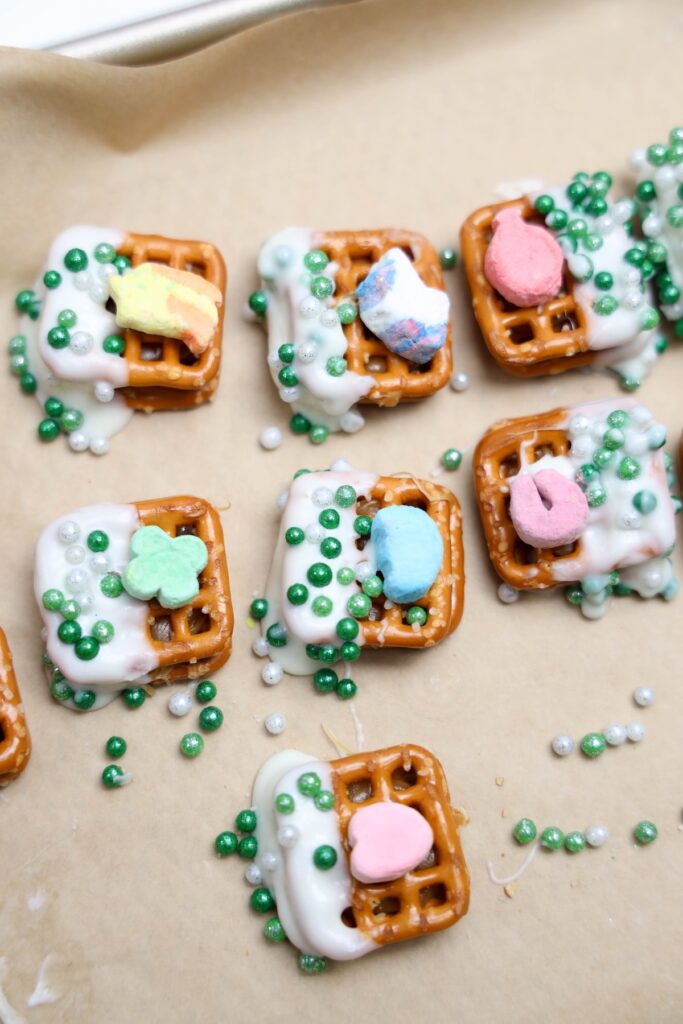 Caramel pretzel topped with marshmallows and sprinkles