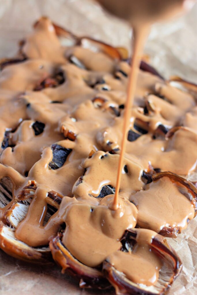 Drizzling peanut butter into dates