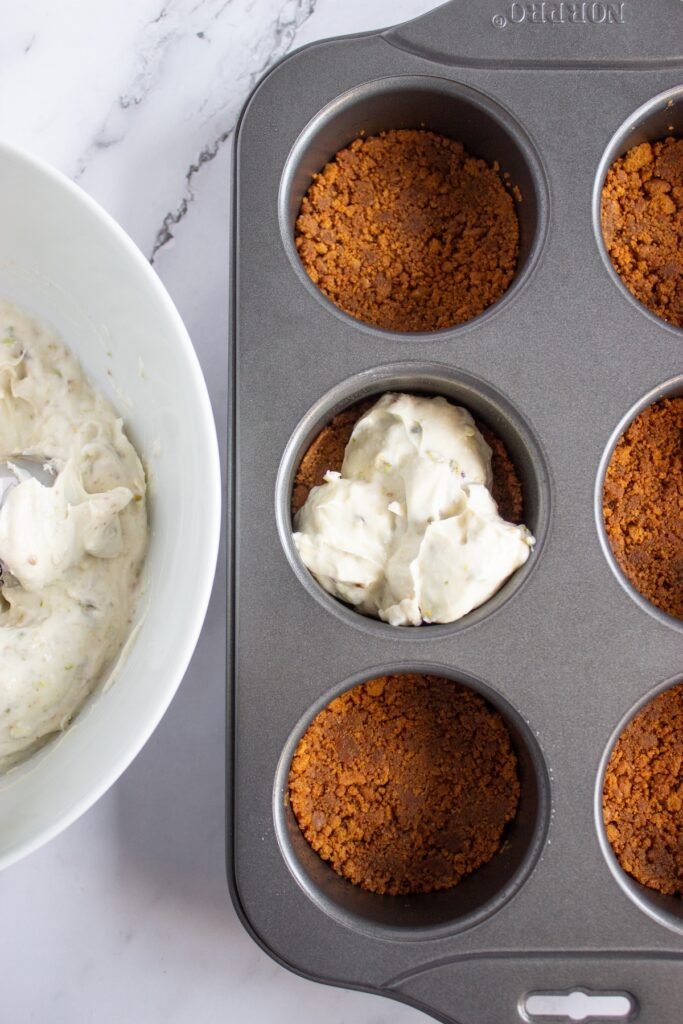 Adding creamcheese mixture to the cheesecake