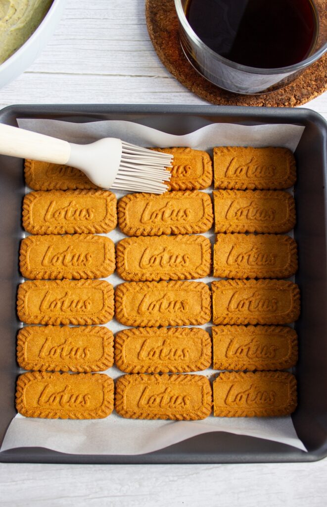 Spreading espresso to the biscoff for the pistachio biscoff tiramisu