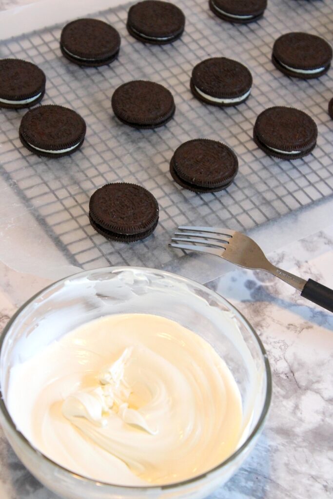Melt candy in a bowl and oreos on baking rack
