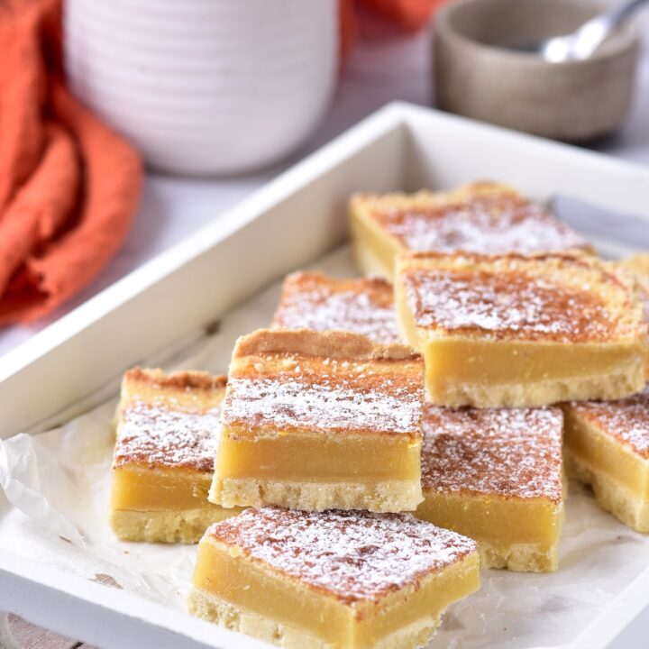 Slices of lemon bars with a cup of tea