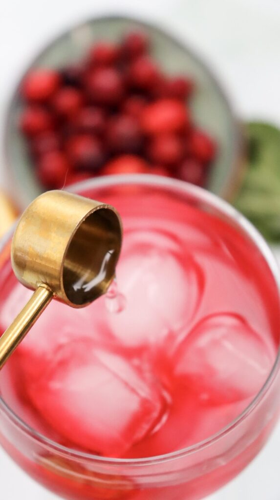 Adding lime juice to the cranberry spritzer