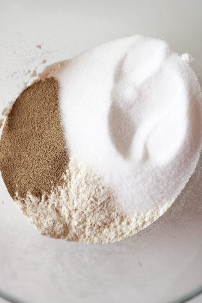 Mixed dry ingredients in a bowl for pink orange home made donuts recipe