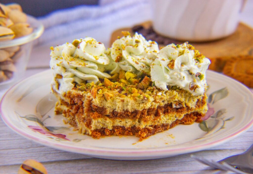 Plate with a slice of pistachio biscoff tiramisu