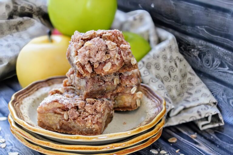 Stack of apple crisp bars in a plate