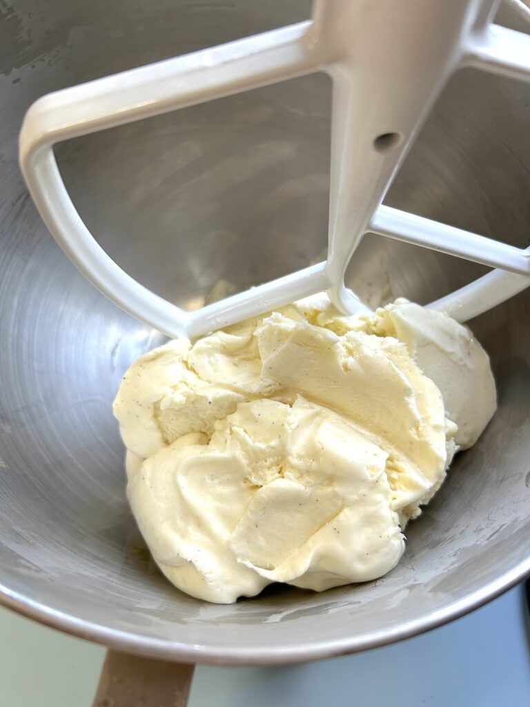 Vanilla ice cream to an empty mixer bowl