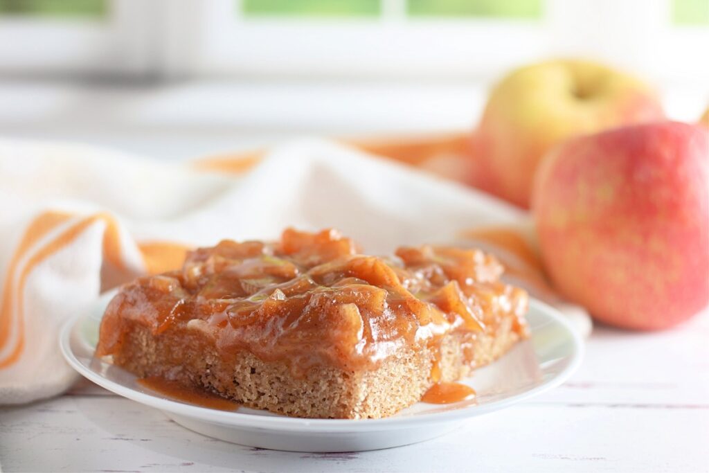 sliced caramel apple sheet cake in a plate