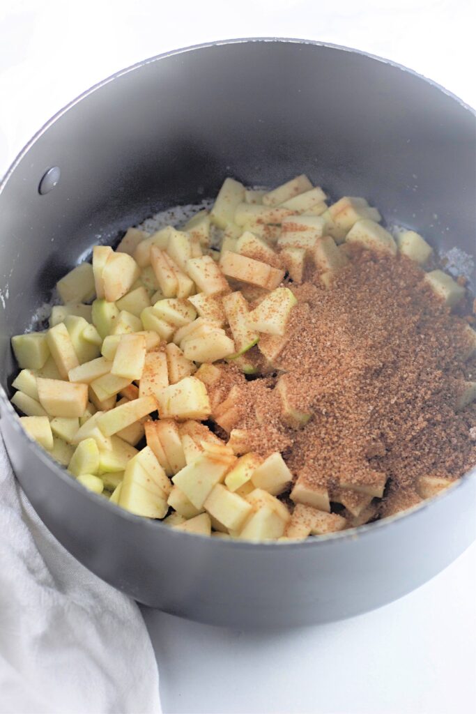 cinnamon and sugar mixture added to diced apples