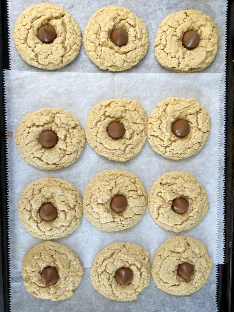 almond flour peanut butter blossom cookies topped with hershet kisses