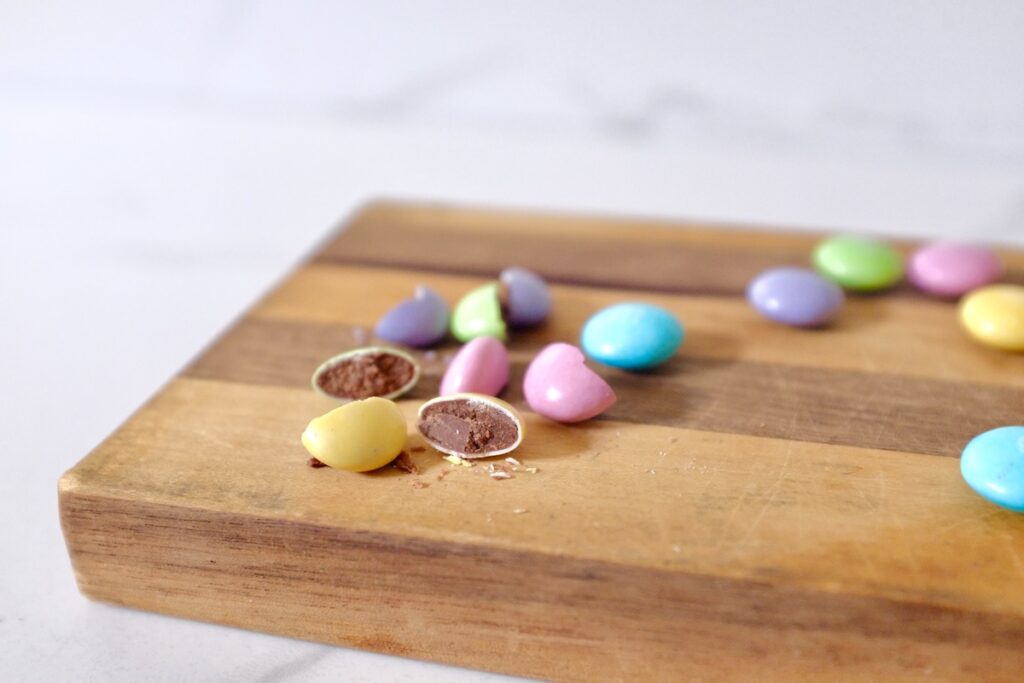 cutting m&m pastel candies into half