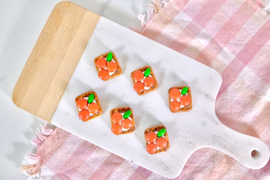 carrot pretzels cute easter snack in a wooden board