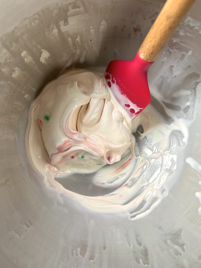 green and red candies mixed with blended ice cream