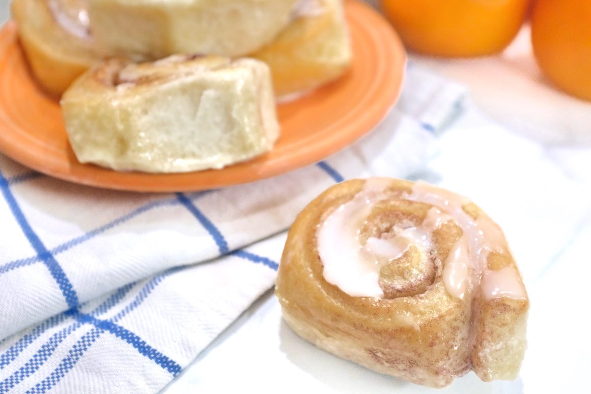 a slice of cinnamon rolls with heavy cream