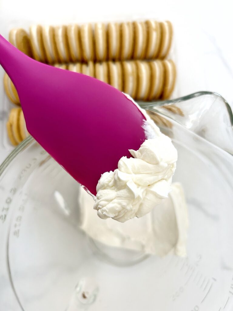 melted block of cream cheese in a bowl