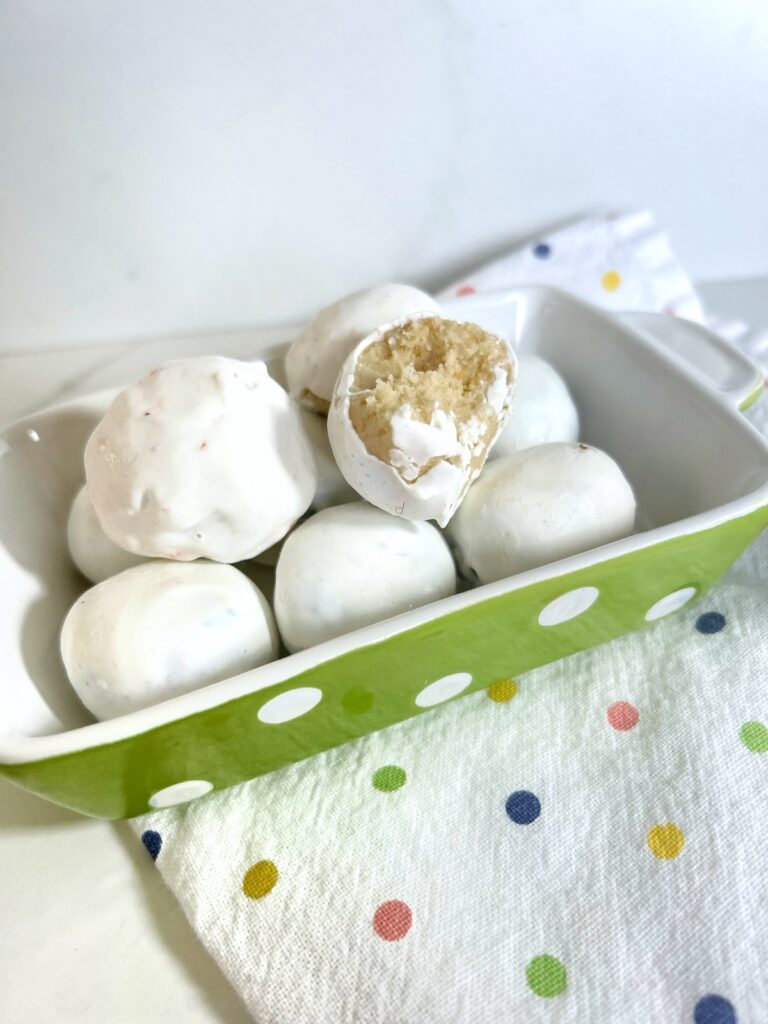 golden oreo balls in a polka dot baking pan