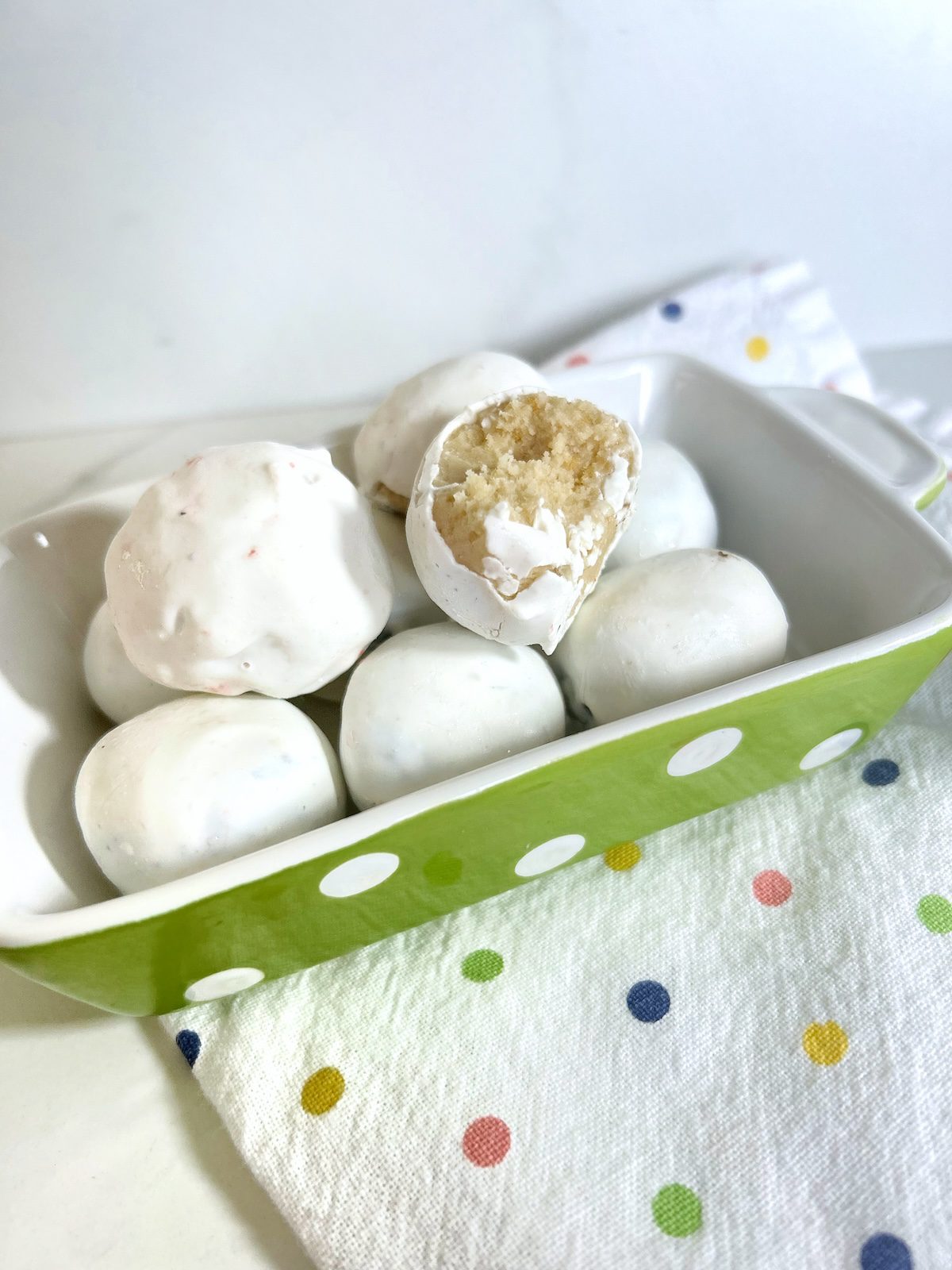 golden oreo balls in a polka dot baking pan