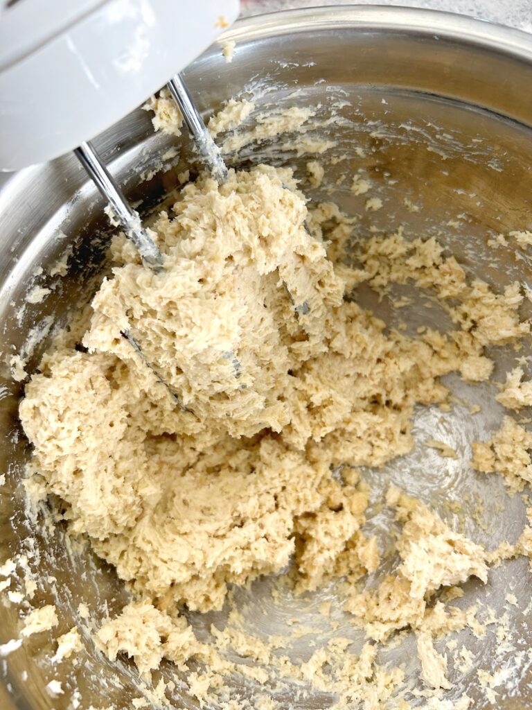 mixed cream cheese and pulverized oreos in a bowl