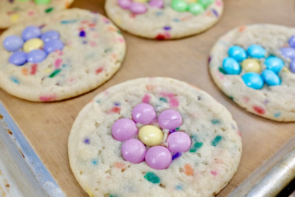 baked coolies with m&ms as flowers as its topping