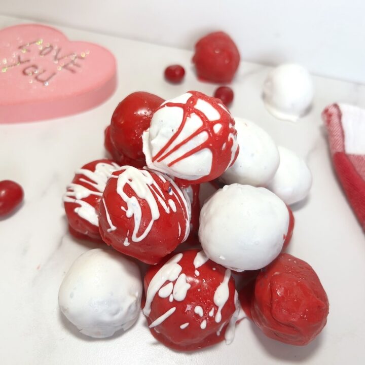 valentine oreo balls coated with red and white melted chocolate