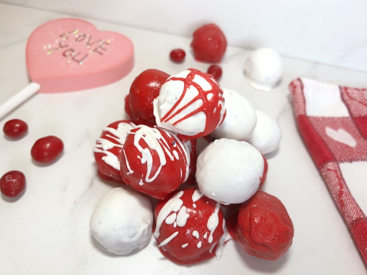 valentine oreo balls coated with red and white melted chocolate