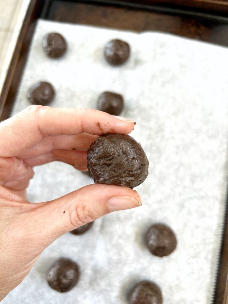 forming balls from the crushed oreos and cream cheese mixture
