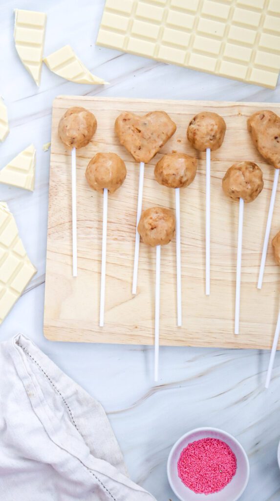 dough shaped into round and heart cake pops