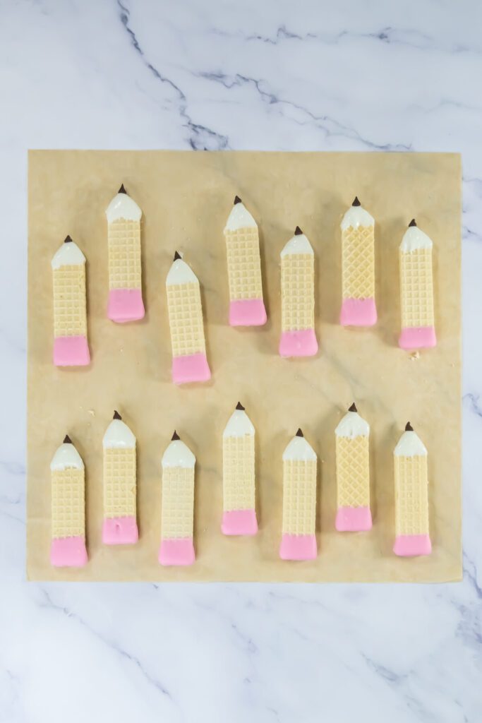 wafer cookies cut and dipped to look like pencils