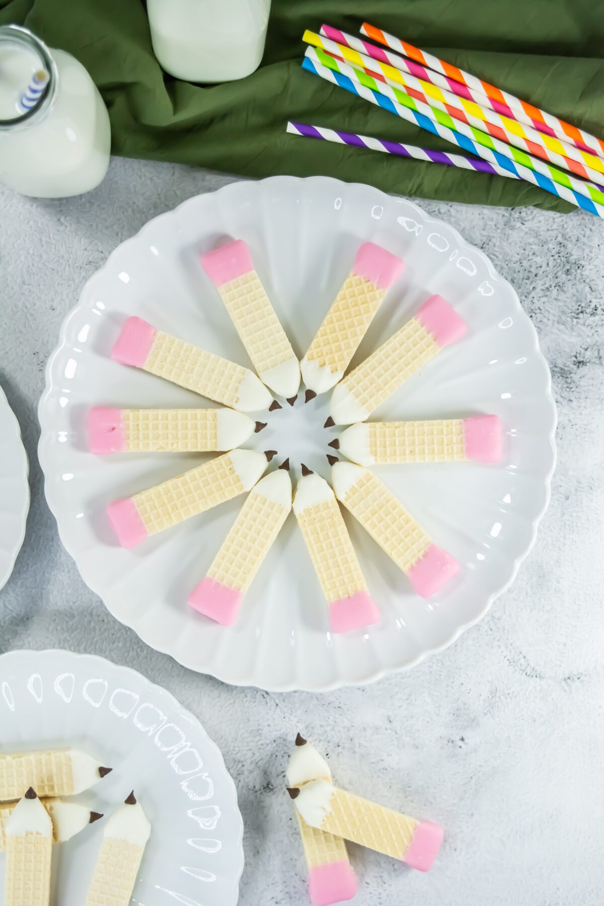 a plate of wafer cookies that look like pencils
