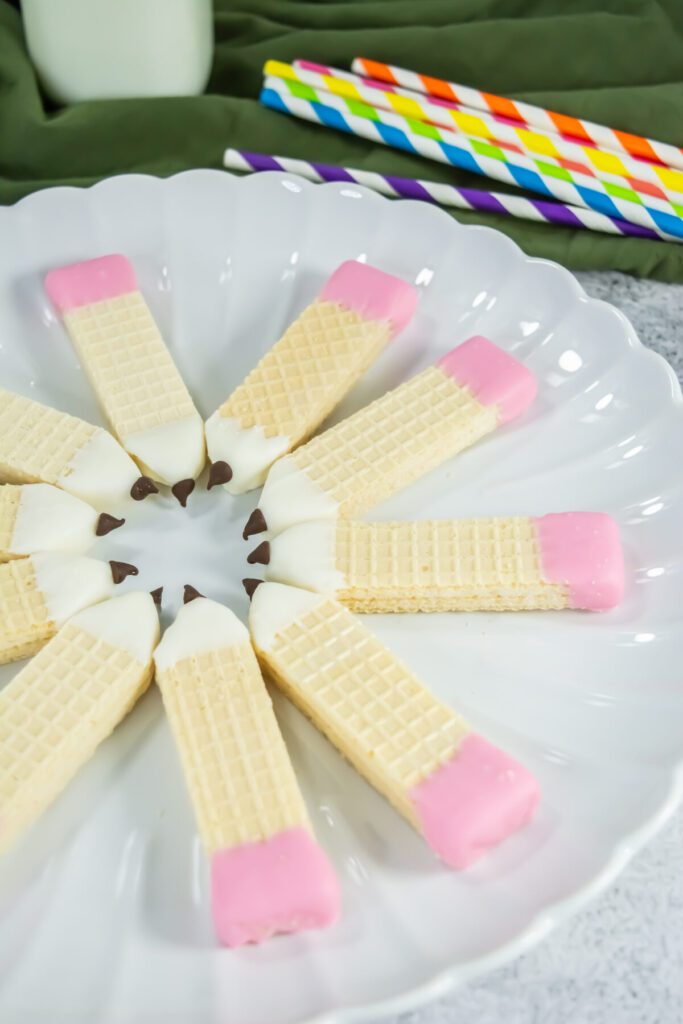 a plate of wafer cookies that look like pencils