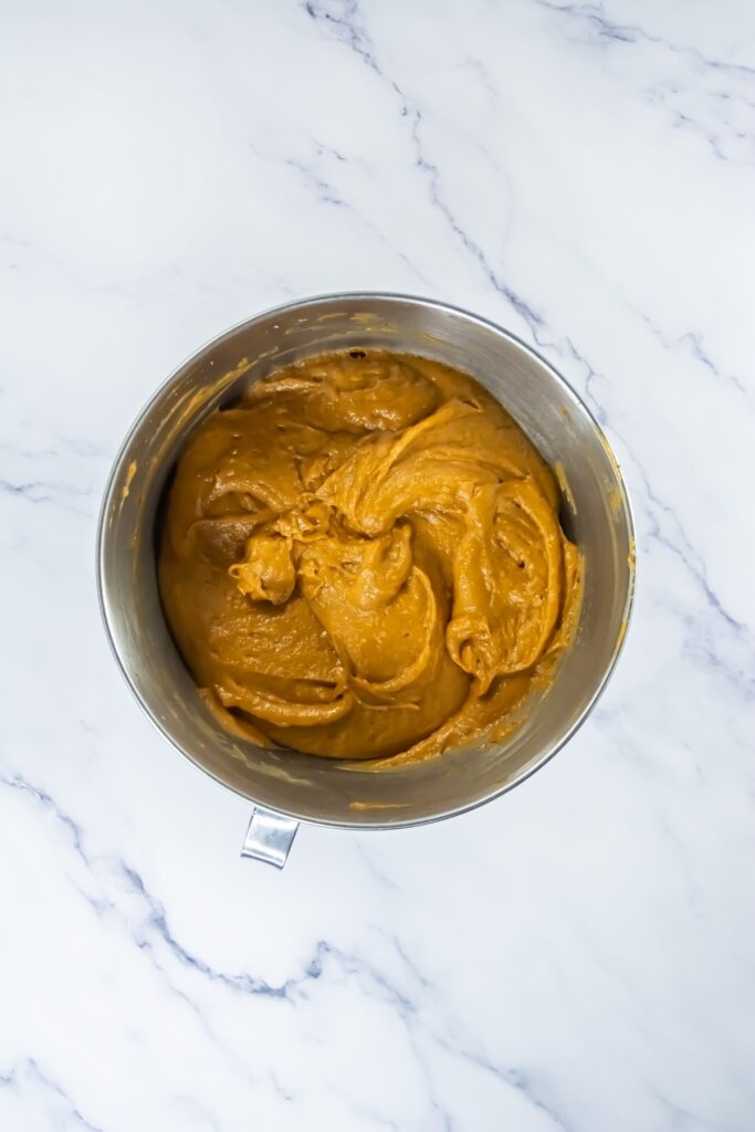 pumpkin cookie batter in mixing bowl