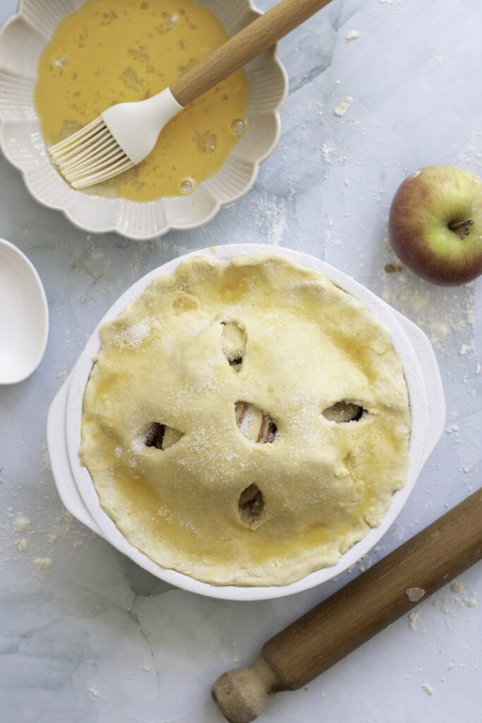 apple pie before baking with an egg wash