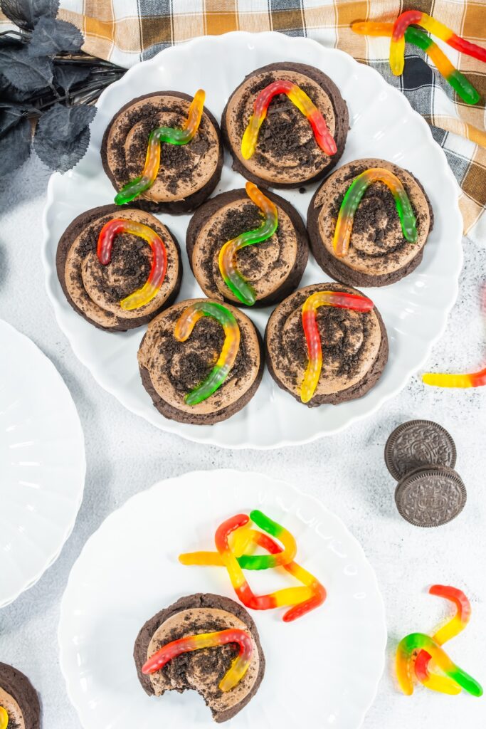 aerial view of dirt cake cookies with gummy worms on a plate