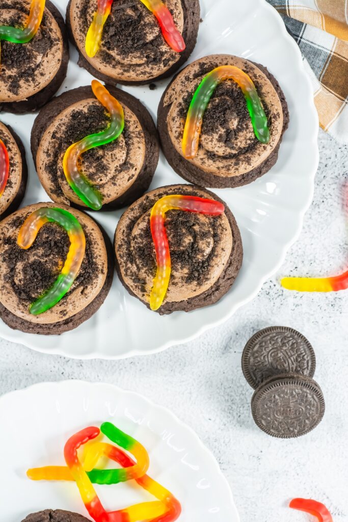 aerial view of crumbl cookie copycat dirt cake cookies with gummy worms on a plate