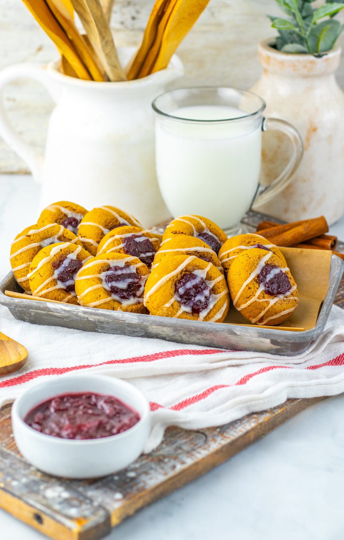 thumbprint cookies on a tray - gingerbread cookies with cranberry sauce filling