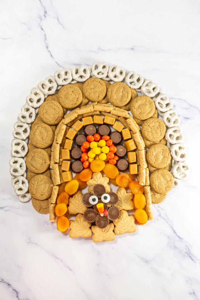 turkey shaped charcuterie board made with cookies and candies