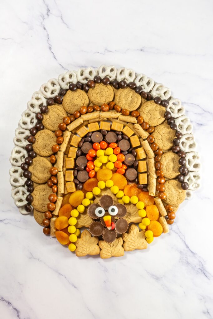 turkey shaped charcuterie board made with cookies and candies