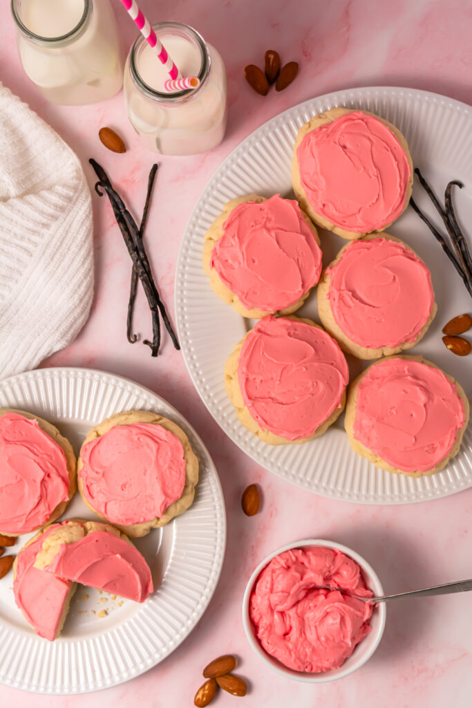 pink frosted crumbl sugar cookie copycat cookies on plates from above