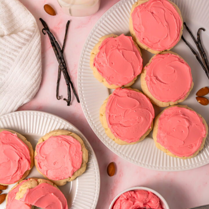 pink frosted crumbl sugar cookie copycat cookies on plates from above