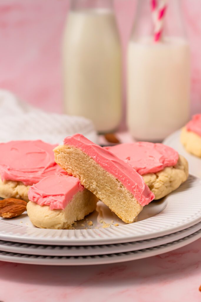 cut in half copycat crumbl sugar cookie on a plate