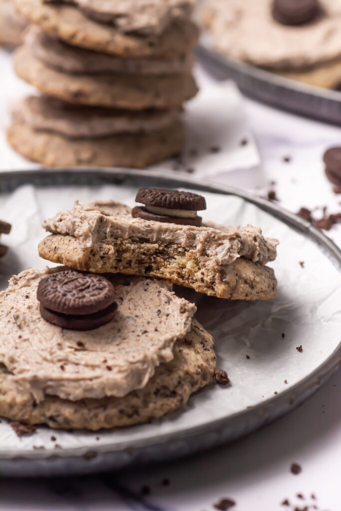 cookies and cream cookies on a plate with one with a bite out of it