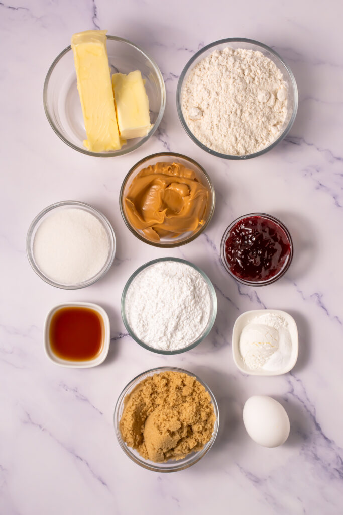 Ingredients in bowls for crumbl cookie peanut butter and jelly cookies from above